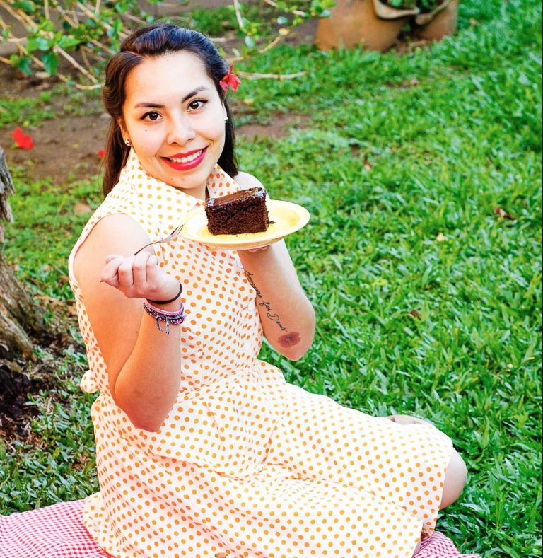 Woman with a healthy relashionship with food eating chocolate cake