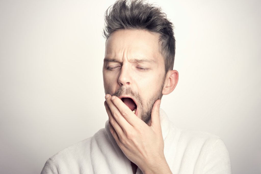 Person with insomnia yawning